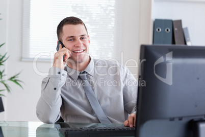 Happy businessman getting pleasant call