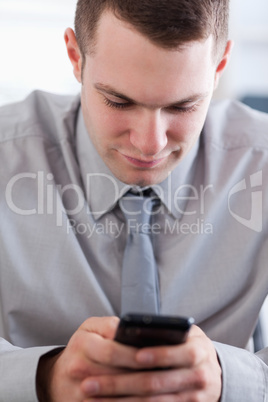 Close up of businessman writing a text message