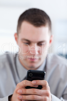 Close up of cellphone being held by businessman