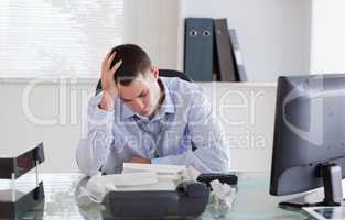 Businessman frustrated by paperwork