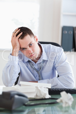 Close up of businessman being depressed by accounting