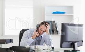Stressed businessman on the phone