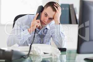 Close up of frustrated businessman on the phone