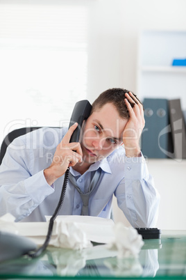 Close up of businessman trying to solve a problem on the phone