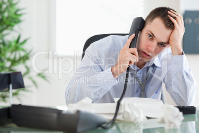 Troubled businessman on the phone