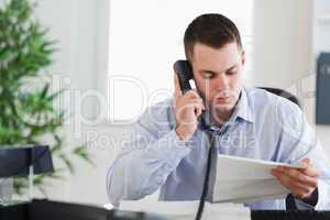 Businessman calling the author of a letter