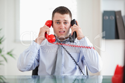 Businessman unable to cope the telephone