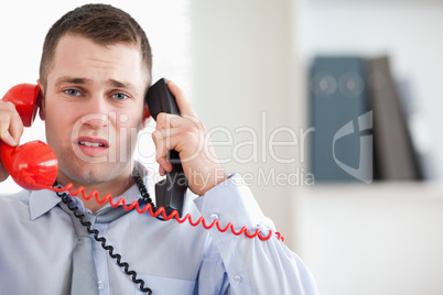 Businessman troubled by the telephone