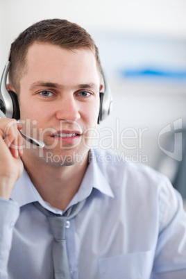 Close up call center agent listening to costumer