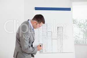 Businessman editing column graph