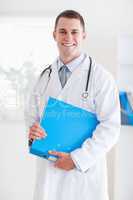 Smiling doctor with folder