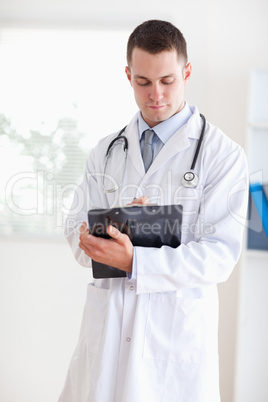 Doctor having a look at his notes