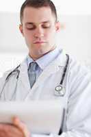 Close up of doctor checking notes