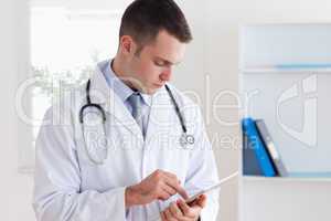 Close up of doctor reading his notes