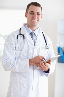 Close up of smiling doctor with notes