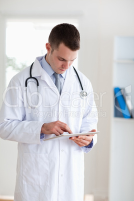 Doctor using his tablet
