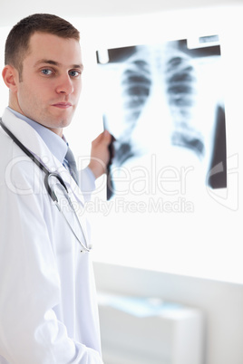 Doctor showing x-ray to patient