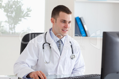 Doctor using his computer