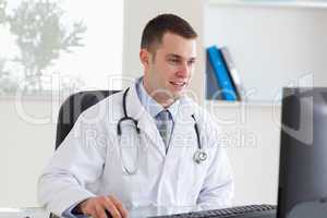 Doctor using his computer