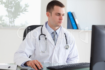 Doctor working on his comptuer