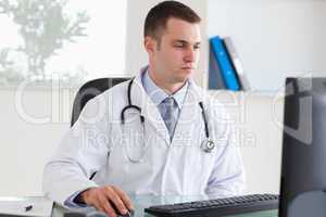 Doctor working on his comptuer