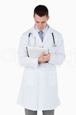 Doctor taking a careful look at his notes