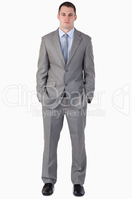 Young businessman with hands in his pocket