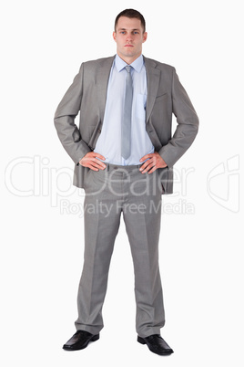 Businessman with arms akimbo