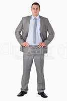 Businessman with arms akimbo