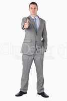 Businessman giving thumb up