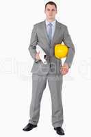 Architect with helmet and plans