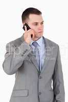 Close up of serious looking businessman on the phone