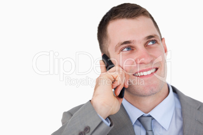 Close up of businessman looking up while on the phone