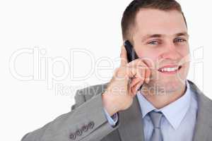 Close up of businessman looking up while on the cellphone