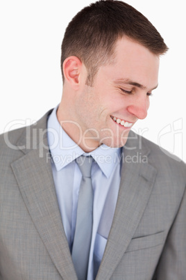 Close up of smiling businessman looking down