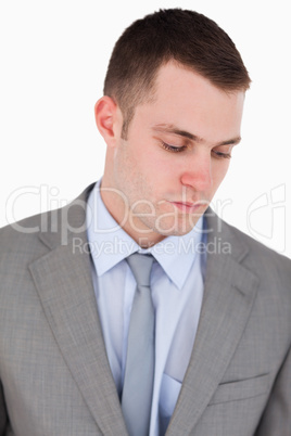 Close up of serious businessman looking down