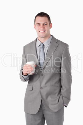 Portrait of a young businessman holding a cup of tea