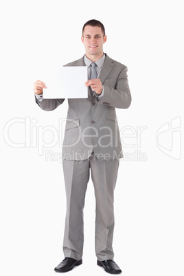 Portrait of a businessman showing a blank panel