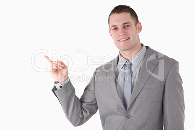 Young businessman pointing at something