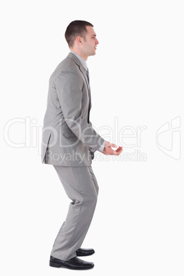 Portrait of a handsome businessman carrying something
