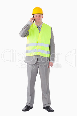 Portrait of a young builder making a phone call