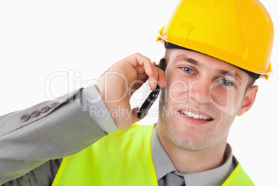 Close up of a young builder making a phone call