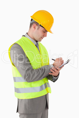 Portrait of a builder taking notes