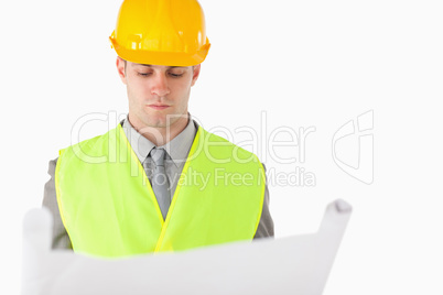 Builder looking at a plan