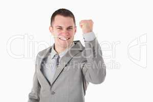 Young businessman with his fist up