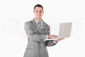 Businessman posing with a laptop