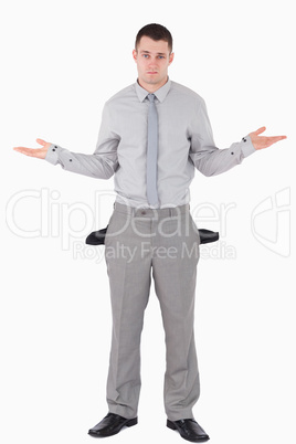 Portrait of a young businessman with empty pockets