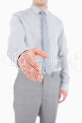 Portrait of a businessman giving a helping hand