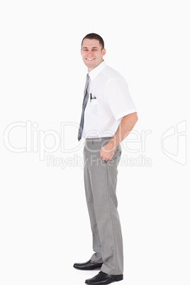 Portrait of a young office worker with the hands on his pockets