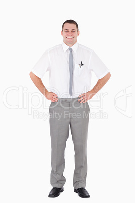 Portrait of an office worker with the hands on his hips
